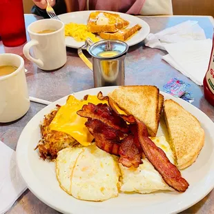 French toast + 2 eggs, bacon, has browns w/ cheese