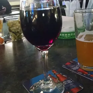 a glass of wine and a glass of beer
