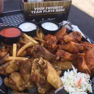 24 wings: half lemon pepper and half mild flavor. We also added fries and slaw for an additional $1.99