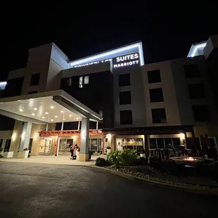 Entrance features a fire pit patio area and excellent lighting.