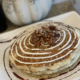 Cinnabomb Pancakes with pecans- cinnamon swirl, cream cheese glaze, and pecans