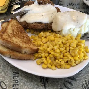 Chicken fried steak, mashed potatoes, corn and sourdough toast. Small salad too!