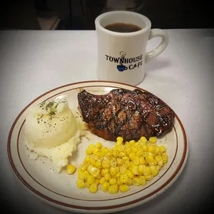 Ribeye steak with real garlic mashed potatoes and corn.