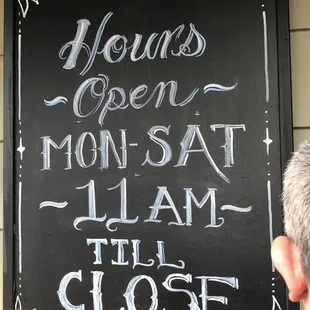 a man looking at a sign