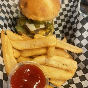 Double burger with green chile and steak fries.