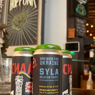 two cans of beer on a table