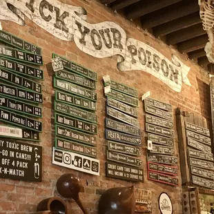 a brick wall with various signs