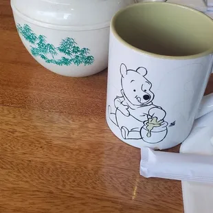 a teapot and a mug on a table