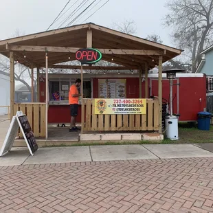 Cute and charming entrance and seating area with heat lamp