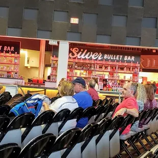 Note the venue's folding chairs.  The open bar is somewhat cool.