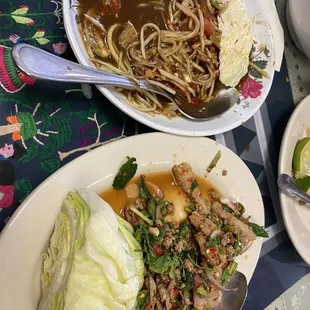 Spicy papaya salad and spicy ground beef with herbs and spices.  Very flavorful indeed.