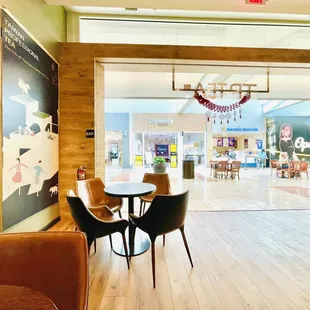 a table and chairs in the lobby