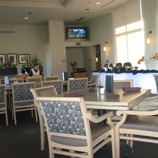 Part of the dining room with the set up for a lunch buffet.
