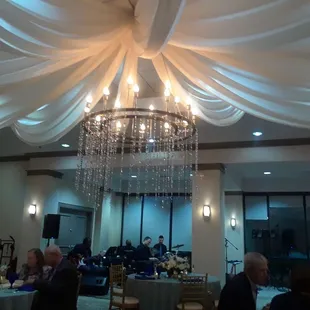 Room with ordered linens and coloredglass beads mixed with their clear beads