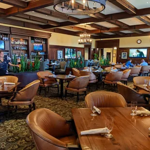 Inside. Dining room and bar with TVs. Nineteen restaurant, inside the TPC Sawgrass clubhouse.