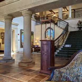 Inside the clubhouse lobby. Beautiful large golf paintings of THE PLAYERS Championship past. THE PLAYERS Championship trophy.