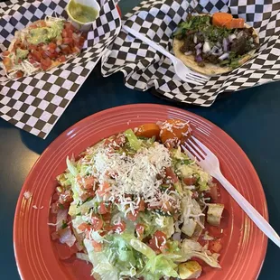 Chicken tostada with a useless fork. Carne asada taco and a fish taco