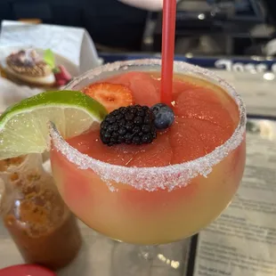 Beautifully made frozen strawberry mango margarita