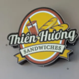 a neon sign for a sandwich shop
