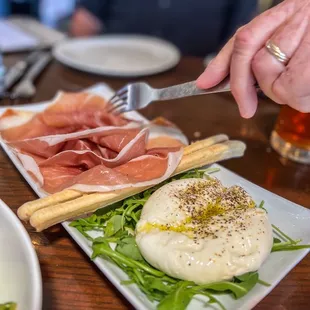 Buratta Con Prosciutto -- stale breadsticks and buratta needs more salt.