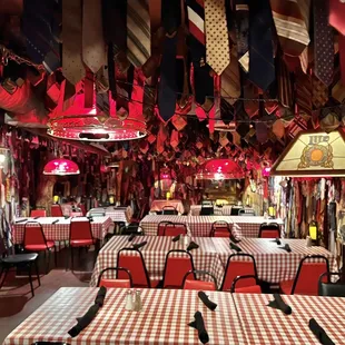 a dining area with tables and chairs