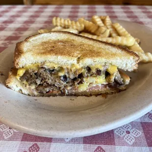 a grilled cheese sandwich and french fries