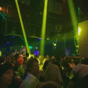 a group of people dancing in a club