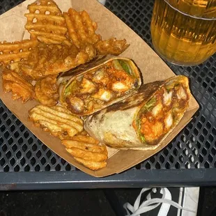 a plate of french fries and a sandwich