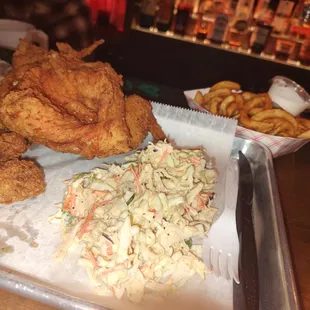 4 pc chicken with homemade Cole slaw and a basket of fries