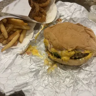 Single cheeseburger, onion rings and fries