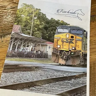 a photo of a train on the tracks