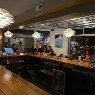 people sitting at the bar