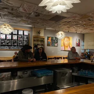 customers sitting at the bar