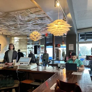 two men working on laptops