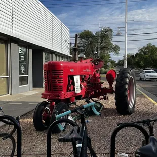 a tractor parked in front of a building