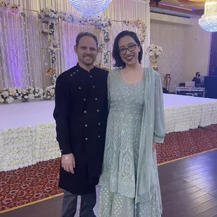 My fiancé and I at the party with my altered dress.