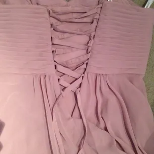 Dress was previously just a zipper. They installed a beautiful matching corset.