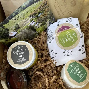 May 2021 Cheese Board selection featuring Stepladder Creamery cheeses plus almonds and dried apricots, and two house-made items.