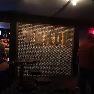 a man standing in front of a bar