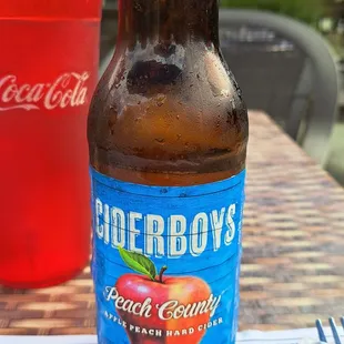 a bottle of ciderboys peach county