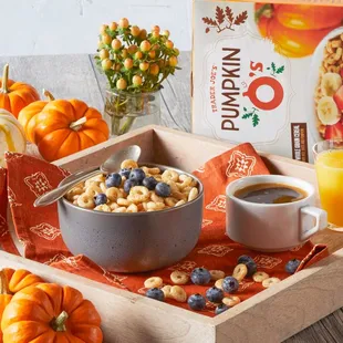 a bowl of cereal and a glass of orange juice