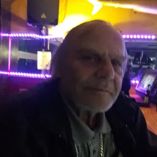 a man with a beard in a bar