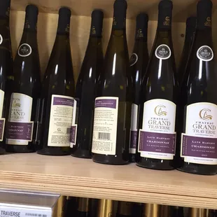 a shelf of wine bottles
