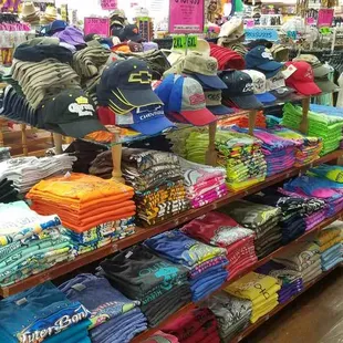 a variety of clothing on display in a store