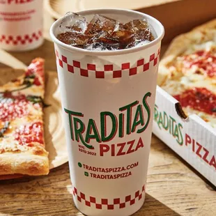 a box of pizza and a drink