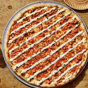 a pizza on a wooden table