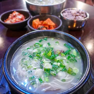 ox bone soup in front, banchan and dumpling soup in back- very enjoyable meal ~ @seattle.food.diva