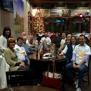a group of people sitting around a table