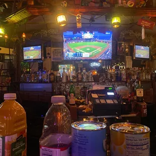 a baseball game being played in a bar