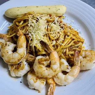a plate of shrimp and pasta